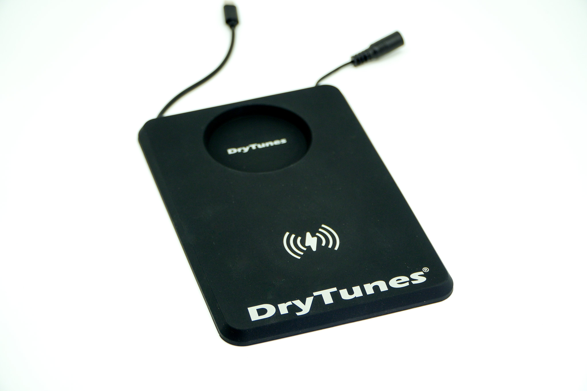 DryTunes Dual Wireless Charging Pad on its own, with the USB-C cable and power lead
